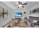 Bright living room featuring brown couches and tile floors at 2808 Touraine Ave, Orlando, FL 32812