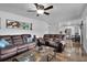 Open concept living room with view into kitchen at 2808 Touraine Ave, Orlando, FL 32812