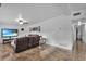 Spacious living room with brown leather furniture and large TV at 2808 Touraine Ave, Orlando, FL 32812