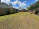 Expansive backyard with privacy fence, offering plenty of room for recreation and landscaping opportunities at 3303 Jon Jon Dr, Orlando, FL 32822