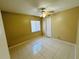 Well-lit bedroom with tile floors and a ceiling fan at 3303 Jon Jon Dr, Orlando, FL 32822