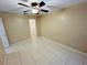 Bedroom with tile floors and ceiling fan, access to closet at 3303 Jon Jon Dr, Orlando, FL 32822