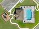 Aerial view of pool, clubhouse and playground with easy access to parking in a modern community at 33425 Country House Dr, Sorrento, FL 32776