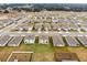 An aerial view of a residential neighborhood with multiple houses at 33425 Country House Dr, Sorrento, FL 32776