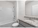 Bathroom showcasing granite countertop vanity, sink and combined shower and bathtub at 33425 Country House Dr, Sorrento, FL 32776