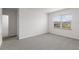 Bedroom featuring plush carpeting, natural light, and an en-suite bathroom at 33425 Country House Dr, Sorrento, FL 32776