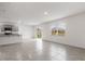 Bright open living space with tile floors, modern kitchen with island, lots of natural light and access to the backyard at 33425 Country House Dr, Sorrento, FL 32776