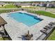 Community pool featuring a zero entry, lounge seating and stairs for easy access at 33425 Country House Dr, Sorrento, FL 32776