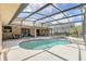 Enjoy this lovely kidney-shaped pool and screened enclosure at 340 Plantation Club Dr, Debary, FL 32713