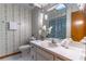 Clean bathroom with updated vanity and patterned wallpaper at 400 Magnolia Oak Dr, Longwood, FL 32779