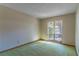 Bright bedroom with large window and light green carpet at 400 Magnolia Oak Dr, Longwood, FL 32779
