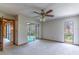 Bright bedroom with ceiling fan and sliding glass doors opening to a screened patio at 400 Magnolia Oak Dr, Longwood, FL 32779
