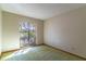 Spacious bedroom with a large window overlooking the backyard at 400 Magnolia Oak Dr, Longwood, FL 32779