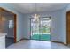 Kitchen dining area with sliding glass doors leading to a screened porch at 400 Magnolia Oak Dr, Longwood, FL 32779