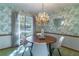 Charming dining room with a round table and chandelier at 400 Magnolia Oak Dr, Longwood, FL 32779