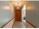 Inviting entryway with wood flooring and patterned wallpaper at 400 Magnolia Oak Dr, Longwood, FL 32779