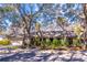 House exterior showcasing a ranch-style home with landscaping at 400 Magnolia Oak Dr, Longwood, FL 32779