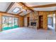 Living room with wood paneling, vaulted ceilings, skylights, and access to a screened porch at 400 Magnolia Oak Dr, Longwood, FL 32779