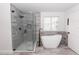 Spa-like bathroom with walk-in shower and soaking tub at 4103 Quail Nest Ct, St Cloud, FL 34772