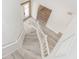 White staircase with wood-look flooring at 4103 Quail Nest Ct, St Cloud, FL 34772