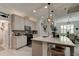 Modern kitchen with island, stainless steel appliances, and white cabinets at 421 High Tide Ln, Daytona Beach, FL 32124