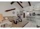 Open-concept living room and kitchen with vaulted ceilings and coastal decor at 421 High Tide Ln, Daytona Beach, FL 32124