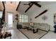 Living room with vaulted ceilings, large sectional sofa, and coastal decor at 421 High Tide Ln, Daytona Beach, FL 32124