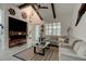 Spacious living room with vaulted ceilings, fireplace, and coastal decor at 421 High Tide Ln, Daytona Beach, FL 32124