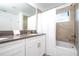 Bathroom with double vanity and shower/tub combo at 4447 Scene Ln, Kissimmee, FL 34746