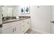 Modern bathroom with double vanity and gray countertop at 4447 Scene Ln, Kissimmee, FL 34746