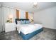 Bedroom with a queen bed and nightstands at 4447 Scene Ln, Kissimmee, FL 34746