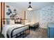 Bedroom with two twin beds and Mickey Mouse wall at 4447 Scene Ln, Kissimmee, FL 34746
