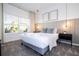 Cozy bedroom with a gray platform bed and neutral decor at 4447 Scene Ln, Kissimmee, FL 34746