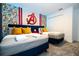 Avengers themed bedroom with twin beds and a large Avengers logo at 4447 Scene Ln, Kissimmee, FL 34746