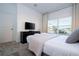 Comfortable bedroom with a gray platform bed and neutral decor at 4447 Scene Ln, Kissimmee, FL 34746
