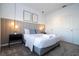 Bright bedroom with a gray platform bed and neutral decor at 4447 Scene Ln, Kissimmee, FL 34746