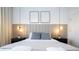 Bright bedroom with a gray platform bed and neutral decor at 4447 Scene Ln, Kissimmee, FL 34746