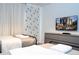 Mickey Mouse themed bedroom with twin beds, TV, and dresser at 4447 Scene Ln, Kissimmee, FL 34746
