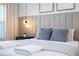 Bright bedroom with a gray platform bed and neutral decor at 4447 Scene Ln, Kissimmee, FL 34746
