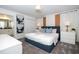 Bedroom with queen bed, nightstands and ensuite bathroom at 4447 Scene Ln, Kissimmee, FL 34746
