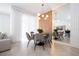 Bright dining area with a round table and gray chairs at 4447 Scene Ln, Kissimmee, FL 34746