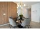 Modern dining area with a round table and gray chairs at 4447 Scene Ln, Kissimmee, FL 34746