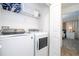Laundry room with washer, dryer, and shelving at 4447 Scene Ln, Kissimmee, FL 34746