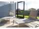 Relaxing patio with lounge chairs and screened enclosure at 4447 Scene Ln, Kissimmee, FL 34746