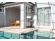 Outdoor kitchen, pool, and patio furniture at 4447 Scene Ln, Kissimmee, FL 34746