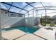 Private screened pool with lounge chairs at 4447 Scene Ln, Kissimmee, FL 34746