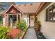 Welcoming front entry with a pathway and lush landscaping at 452 N Pine Meadow Dr, Debary, FL 32713