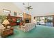 Living Room with brick fireplace and view of pool at 452 N Pine Meadow Dr, Debary, FL 32713