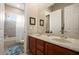 Bathroom featuring double sink vanity and bathtub with shower at 4943 Cains Wren Trl, Sanford, FL 32771