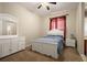 Bright bedroom featuring white furniture, a ceiling fan, and comfortable carpeting at 4943 Cains Wren Trl, Sanford, FL 32771